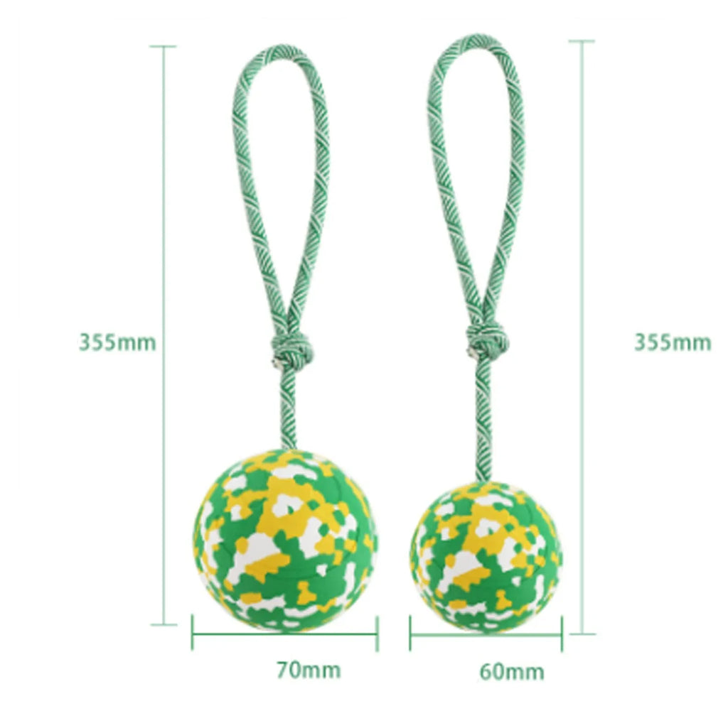 Natural rubber dog ball attached to a blue nylon rope for fetch and tug games