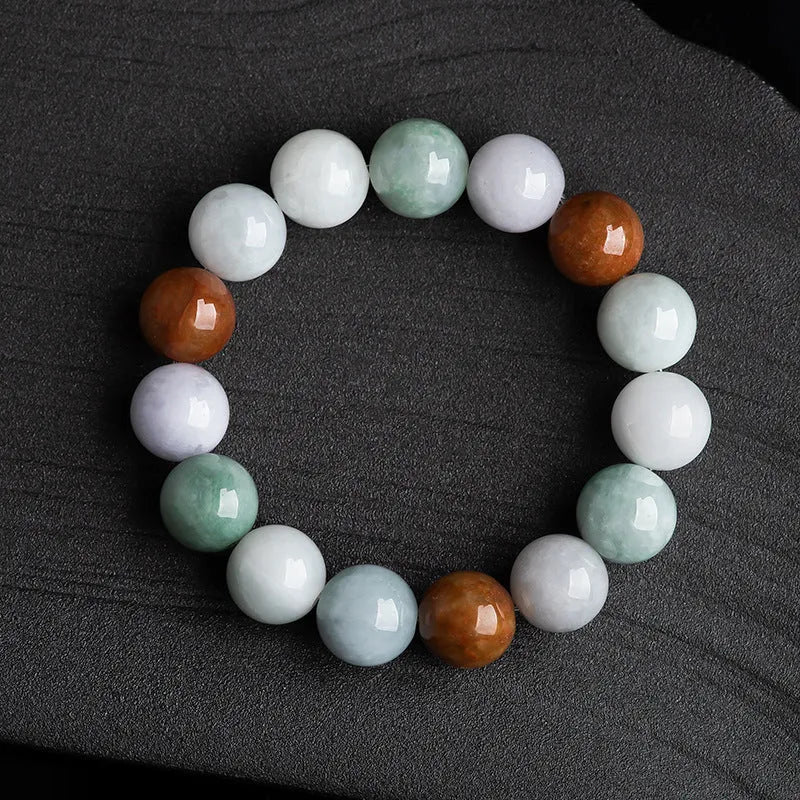 Close-up of a women's bracelet with round 13mm Myanmar jade beads in three colours.