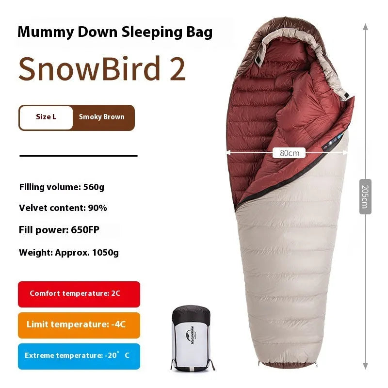 Adult mummy-style sleeping bag with goose down filling shown with its storage bag.