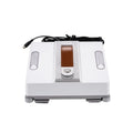 White intelligent window cleaning robot for high-rise buildings on a window pane.