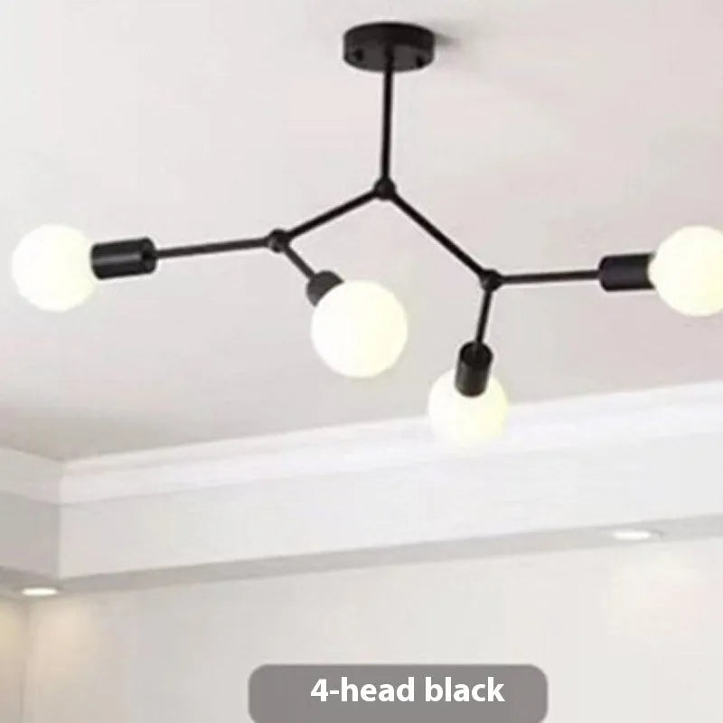 Minimalist black iron ceiling chandelier with six light heads in a Nordic style, against a white background.