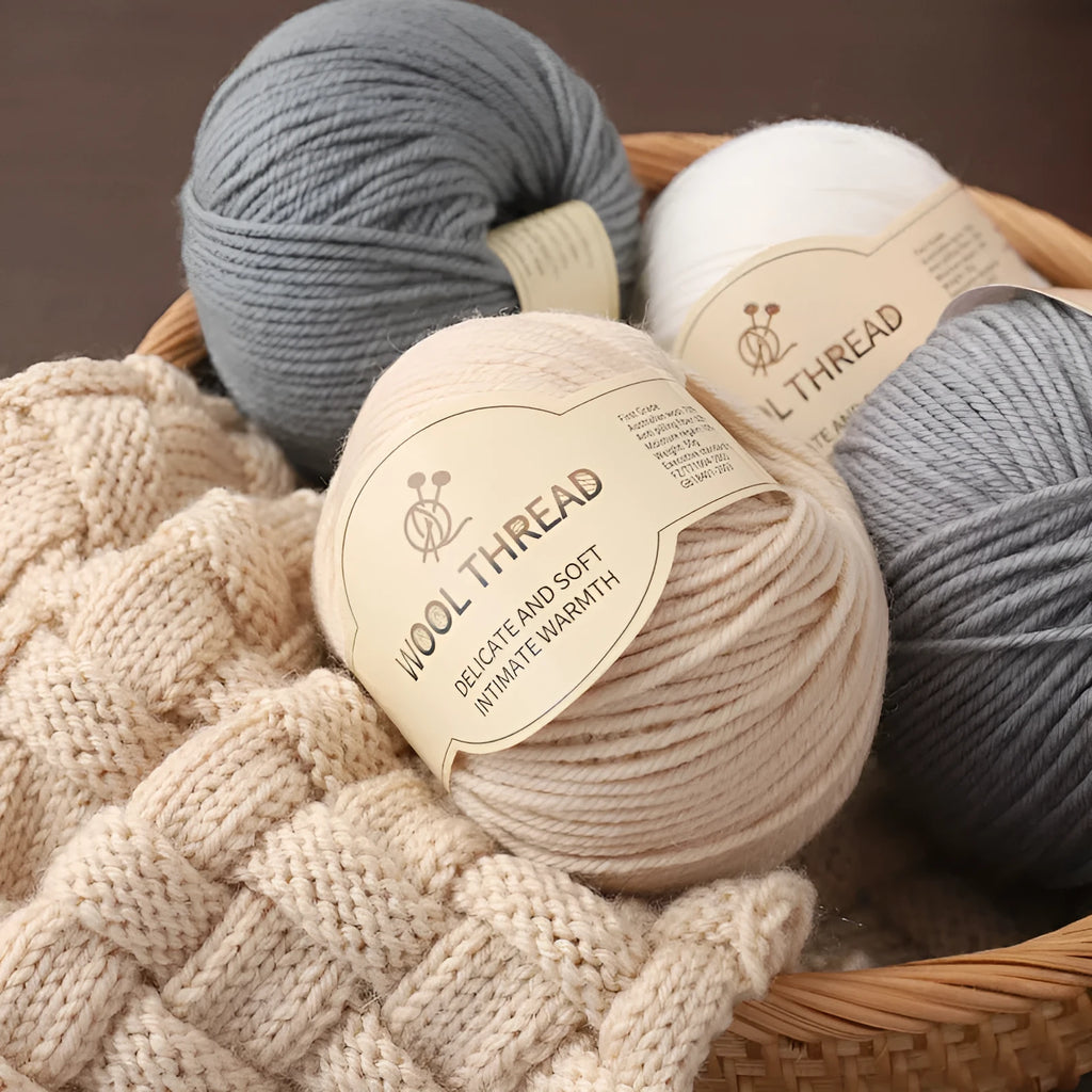 One skein of fine hand knitting wool thread in a choice of colours, shown next to UK size 10 knitting needles.