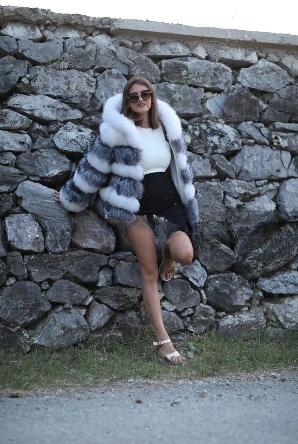 Women's loose artificial fur coat with detachable hood in street fashion style.