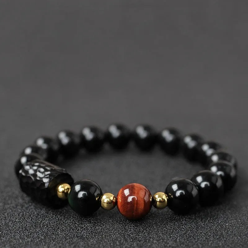 Handmade obsidian bracelet with 10mm yellow tiger eye beads in circular retro design