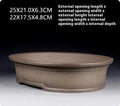 Handmade oval purple sand ceramic bonsai flower pot measuring 25 by 21 by 6.3 centimetres.