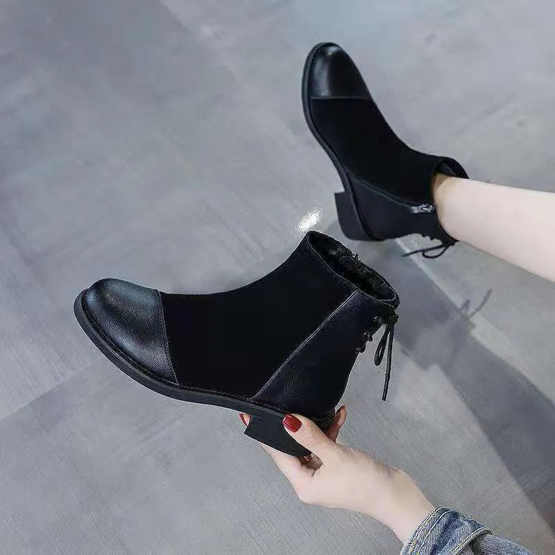 Black women's knee-high Martin boots with side zip and bow detail on a microfibre upper.