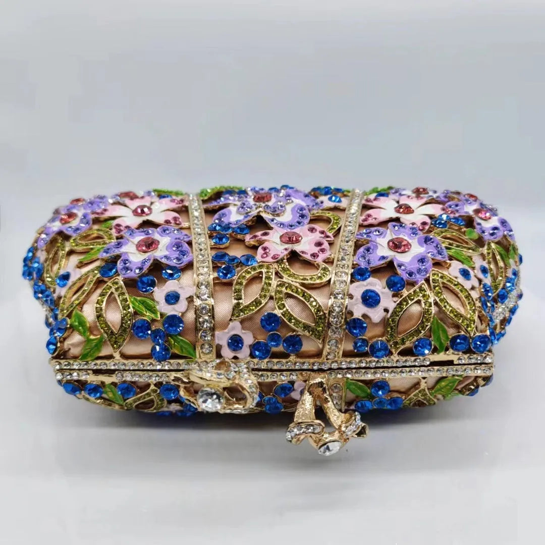 Gold oval metal evening clutch with enamel flower, hollow, diamond and dripping oil detail, 22 x 12 x 6 cm