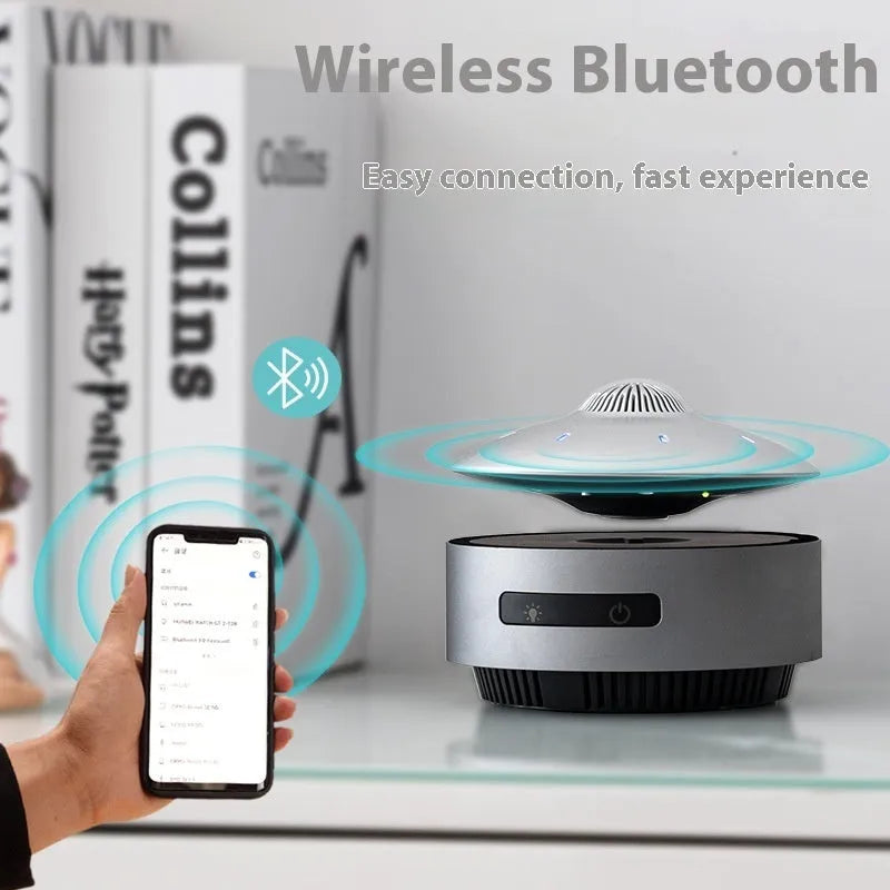 Automatic lifting magnetic levitation Bluetooth speaker floating above its base.