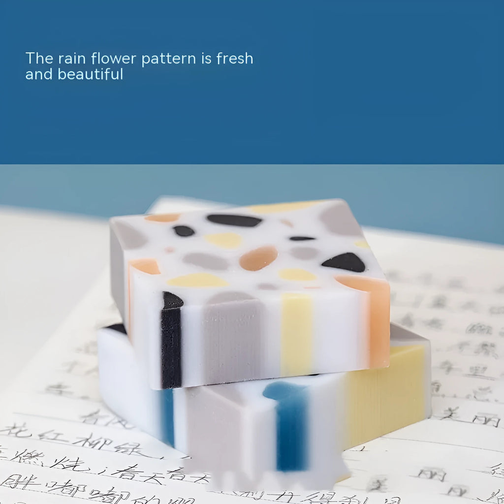 A brick-shaped, single-piece rubber eraser for traceless pencil and charcoal mark removal