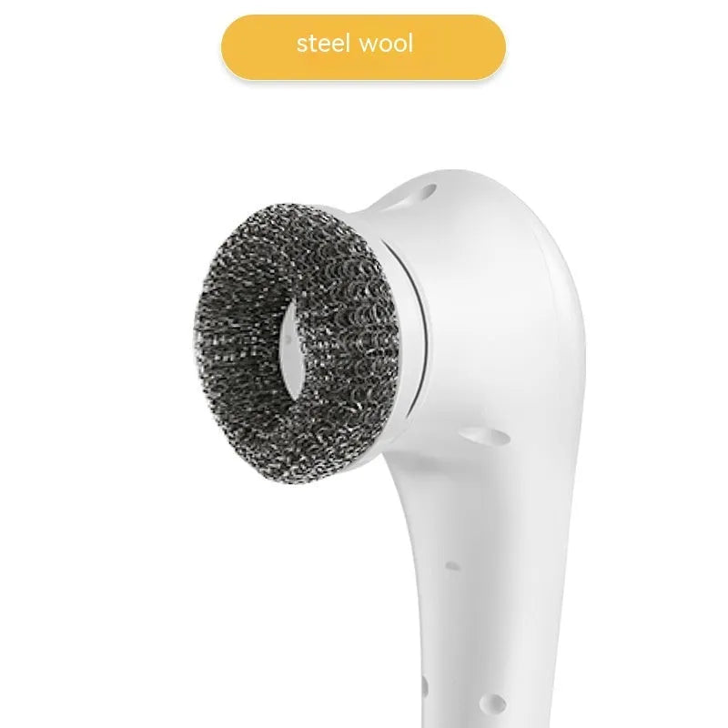White USB rechargeable cordless electric cleaning brush with five different brush heads on a table.
