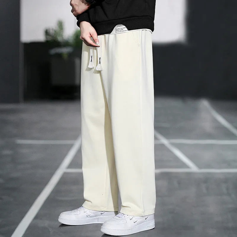 Men's grey Ninth Sports Pants showing high waist and multiple pockets.