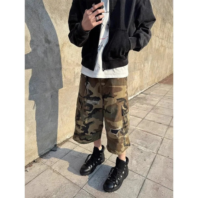 Men's retro patch ripped camouflage cropped jeans showing distressed detailing and straight leg design