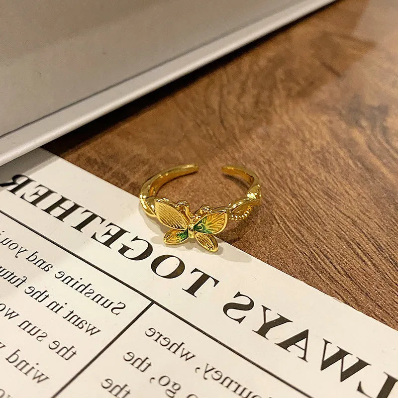 Copper women's ring with Chinese butterfly design and oil-drip finish in simple jewellery style