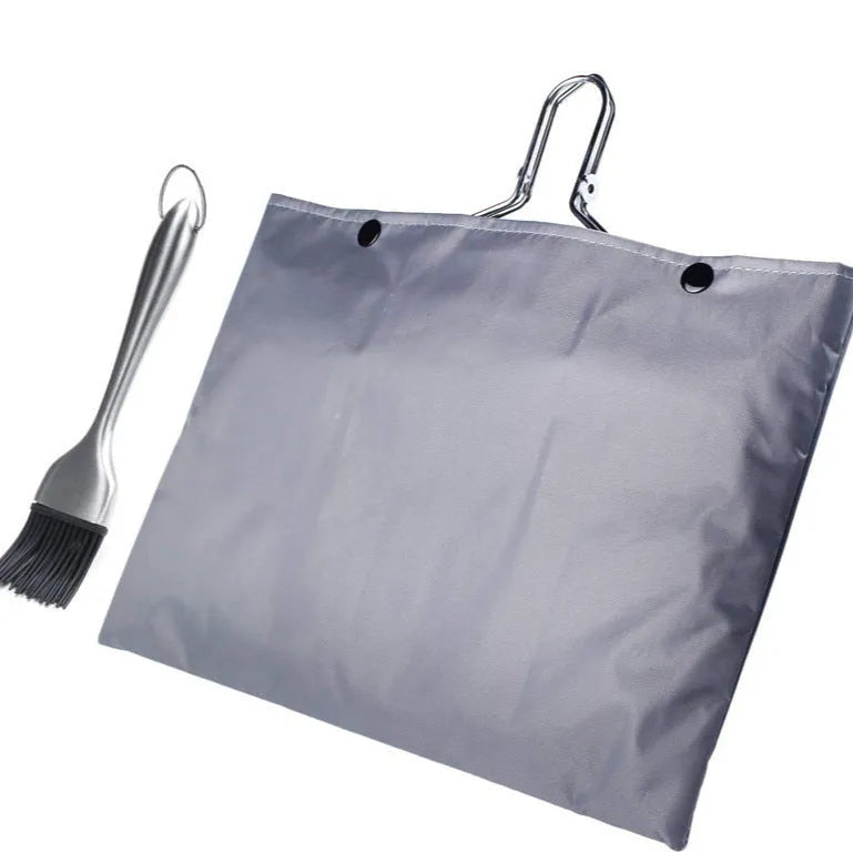 Square stainless steel wire barbecue mesh basket in a folded position with a cleaning brush.
