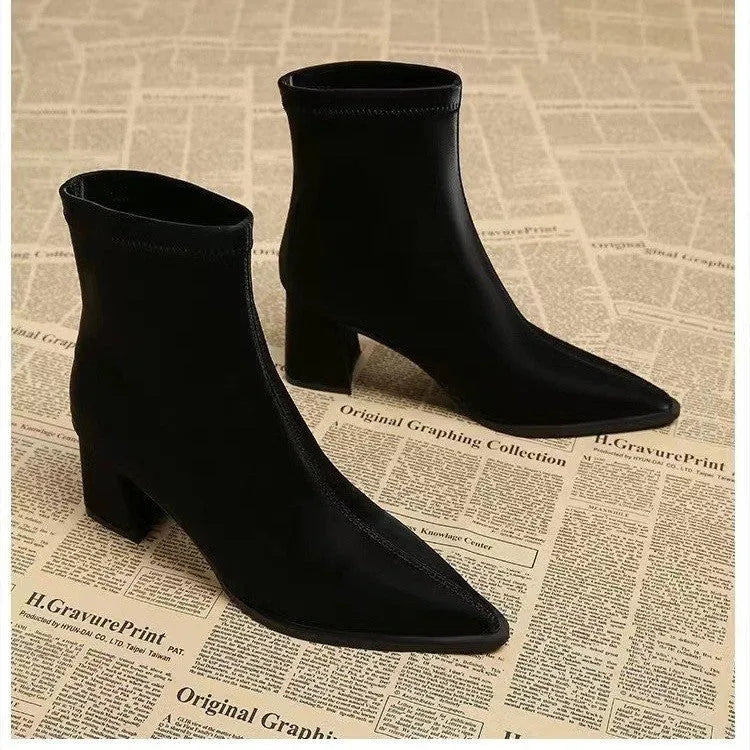 Women's khaki stretch artificial velboa ankle boots with a wedge heel and pointed toe on a plain background.