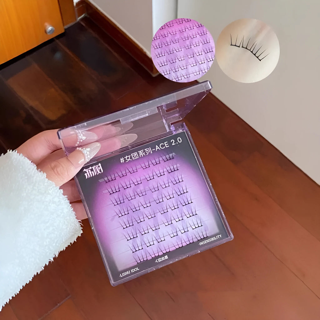 Pack of natural style reusable false eyelash clusters on a strip with adhesive and tweezers.
