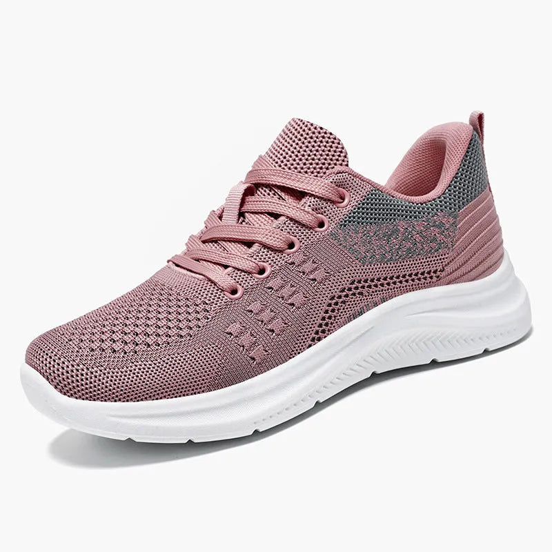 Women's black mesh sneakers with round toe and lace-up front, showing breathable construction and soft PVC sole