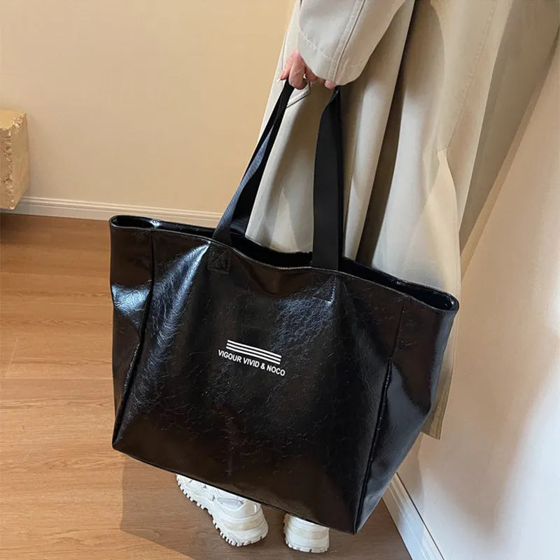 Large capacity PU tote bag for women in solid black, beige or brown, waterproof shoulder handbag for daily and travel use.