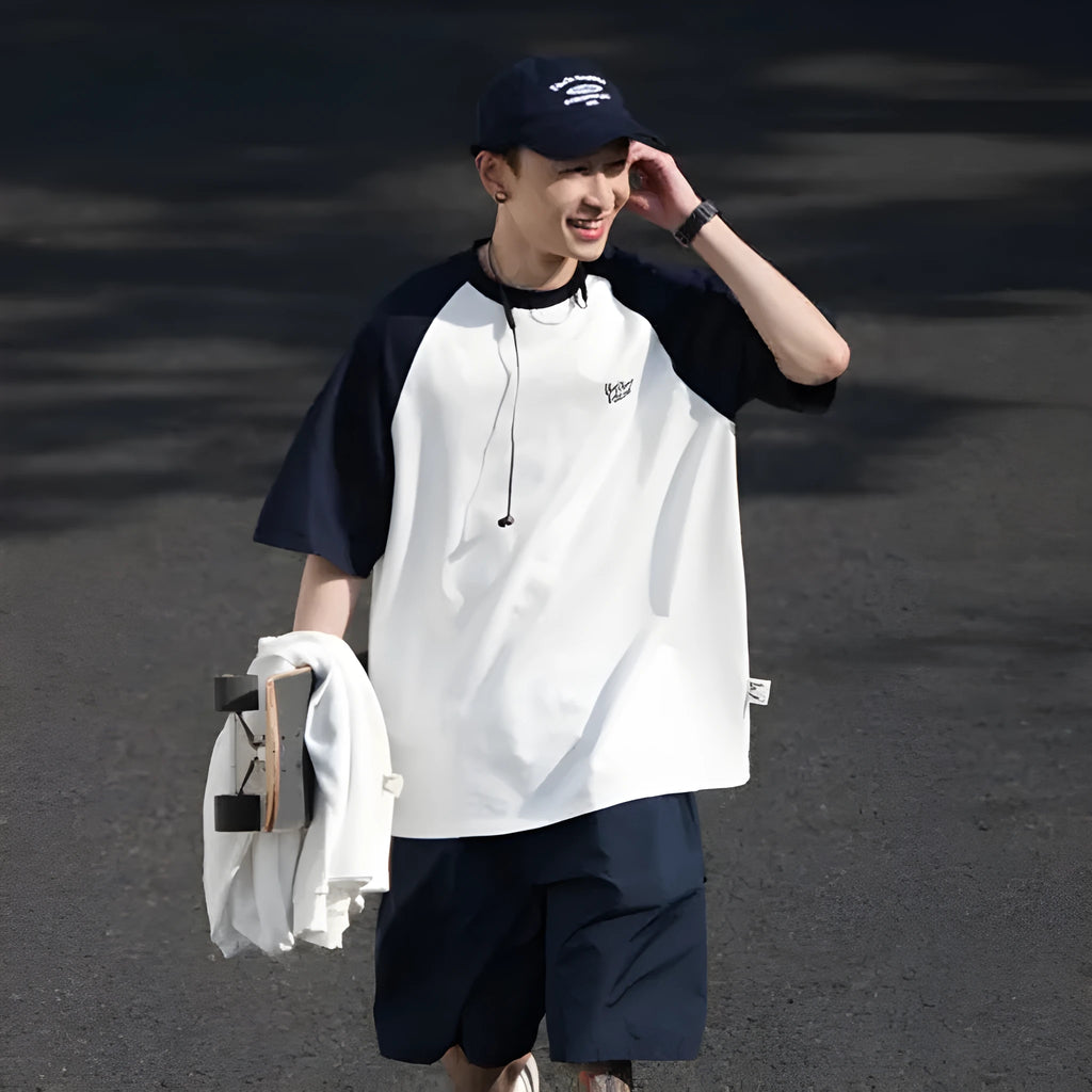 Blue loose-fit men's casual raglan sleeve T-shirt on a hanger