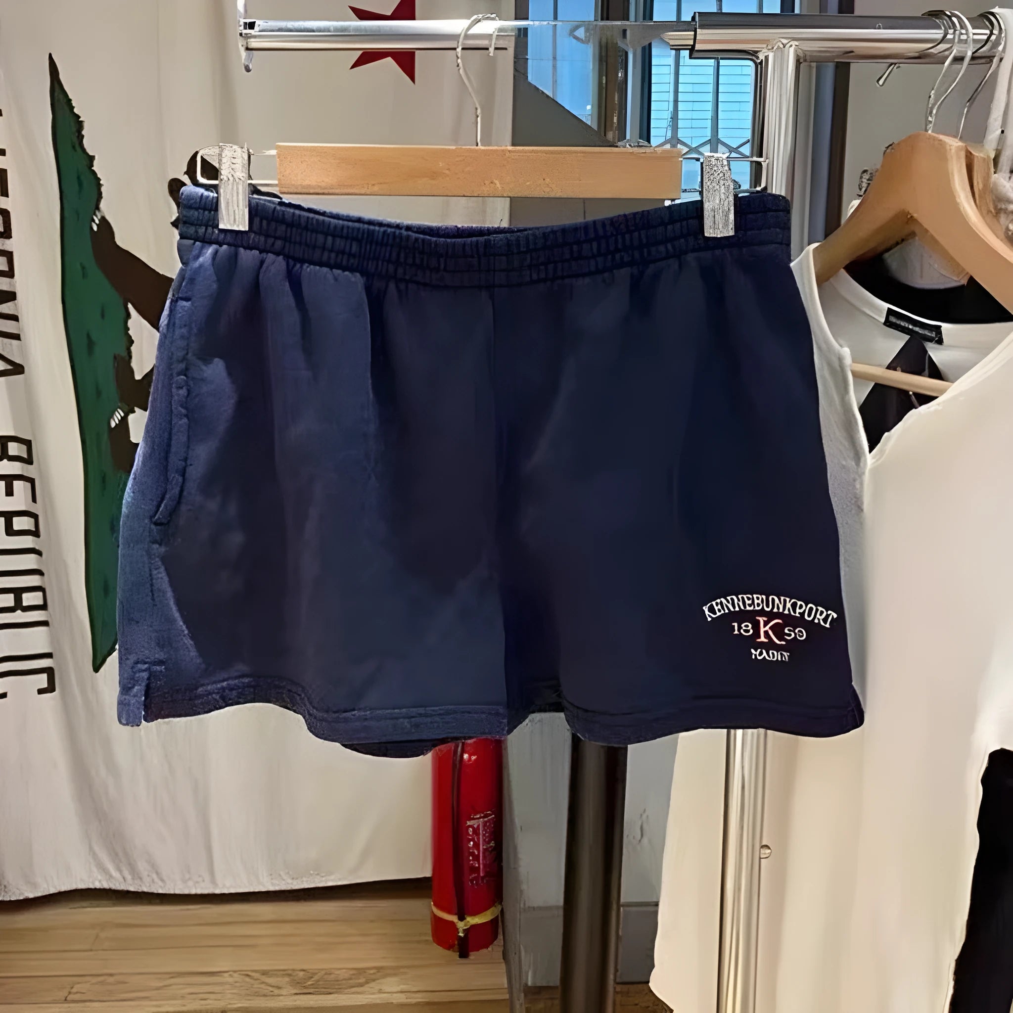 Women's cotton high top sports shorts with white flag embroidery in dark blue colour