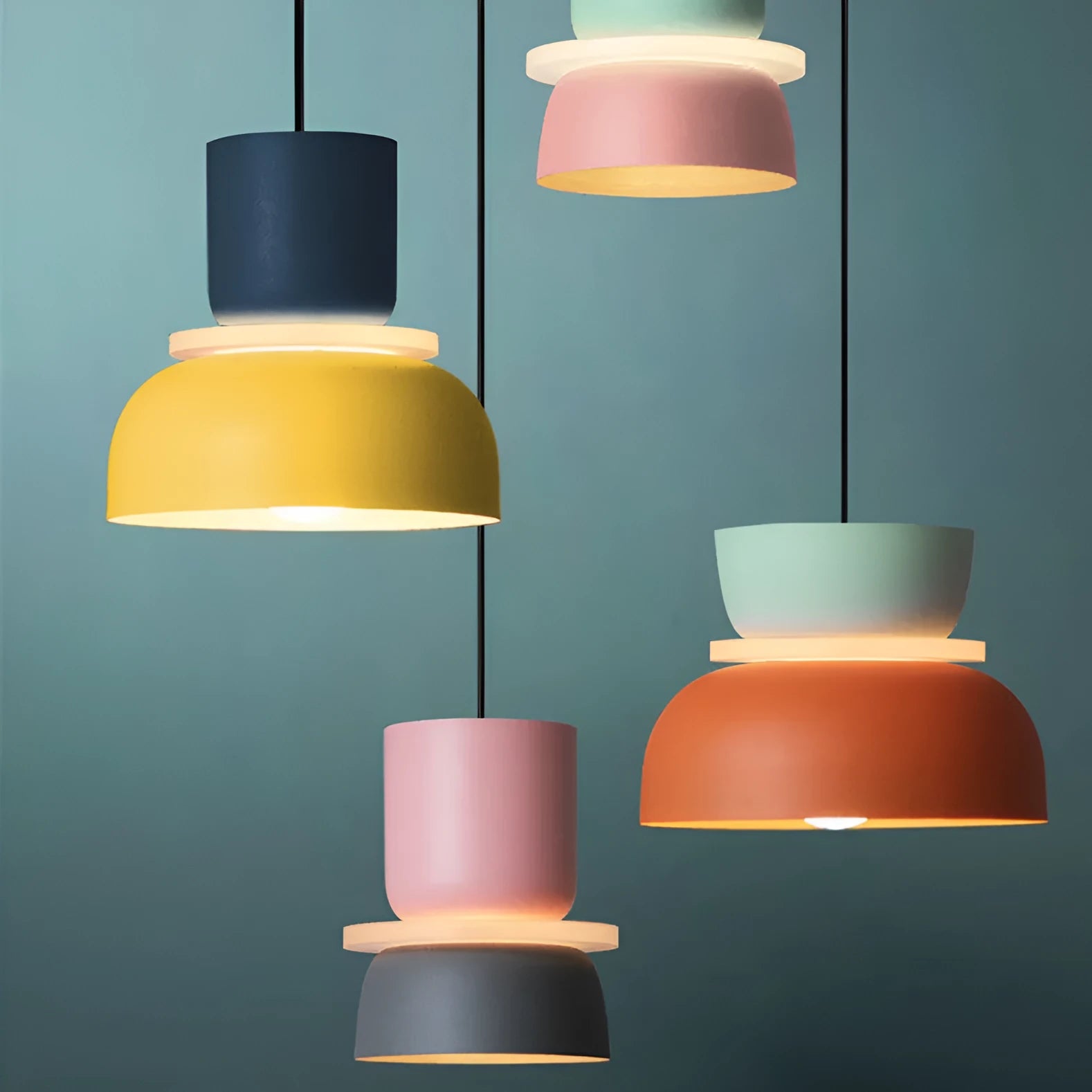 Nordic minimalist iron pendant light in a dark colour with a warm light bulb for bedroom or cafe use