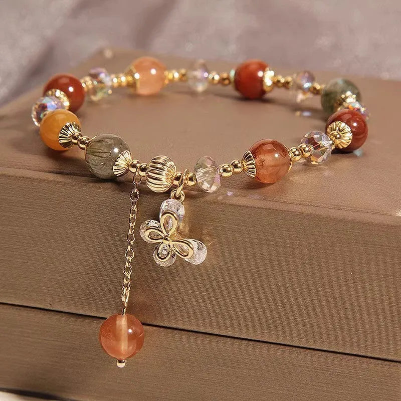 Coloured hair crystal bracelet with cat's paw and butterfly charms in Korean unisex style