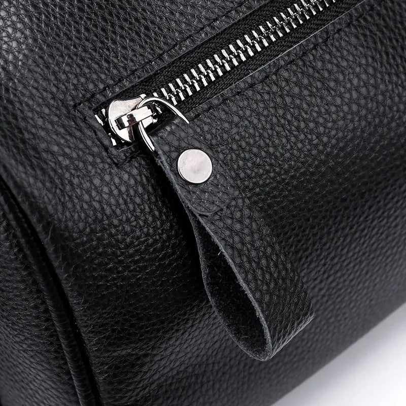 Black genuine leather one-shoulder crossbody bag with dimensions 24cm x 16cm x 13cm
