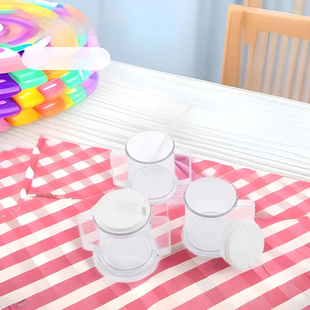 Transparent spill-proof plastic drinking cup on a plain background