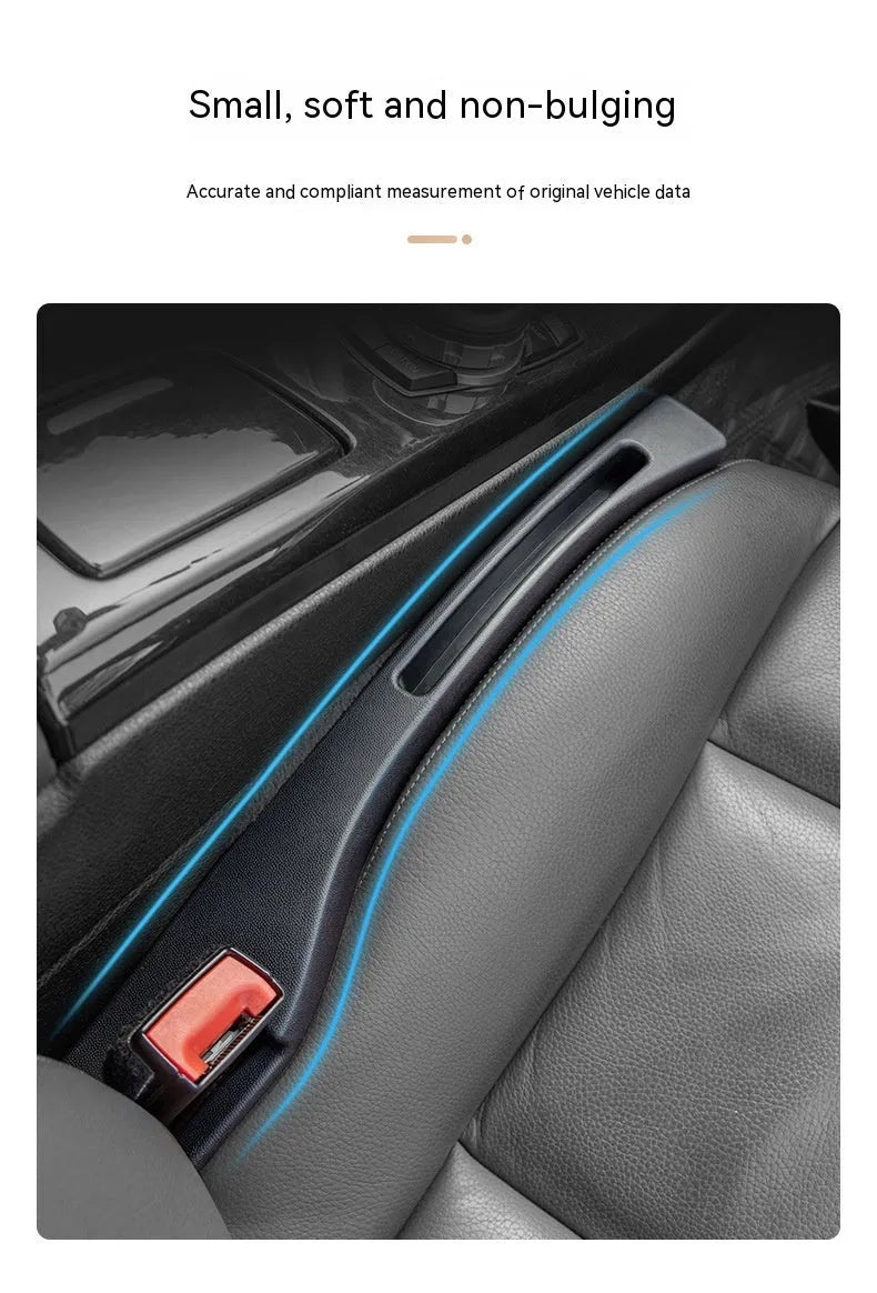 Black plastic car seat gap storage organiser box with handle inserted between vehicle seats