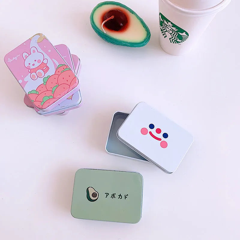 Small white iron storage tin box with printed smiley face design on lid
