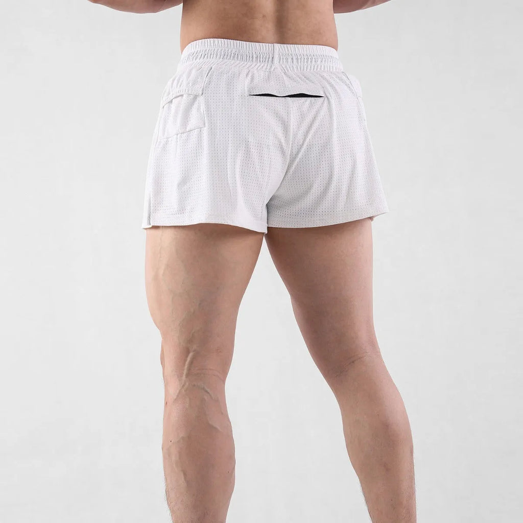 Man wearing black quick-dry nylon shorts with a mid-waist fit for summer sports