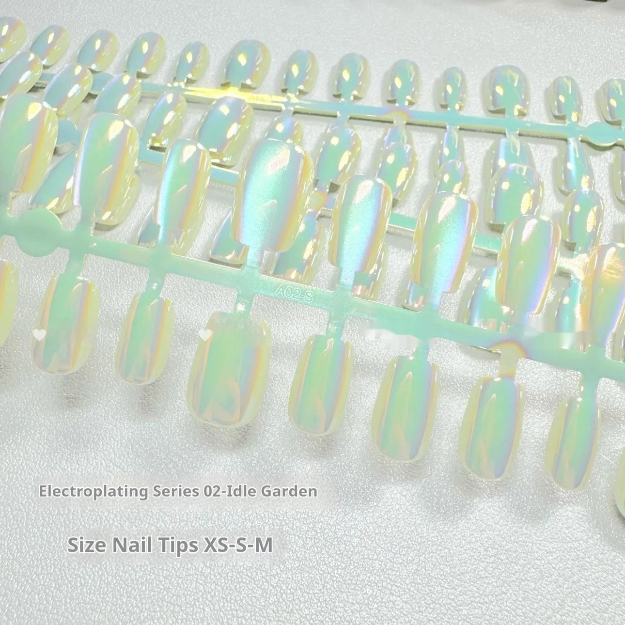Electroplated cat's eye and aurora nail wraps for short ladder XS, S, and M nail sizes.