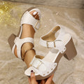 Beige plus-size women's sandals with a thick high heel, fish mouth toe, and an ankle buckle with metal rivets.