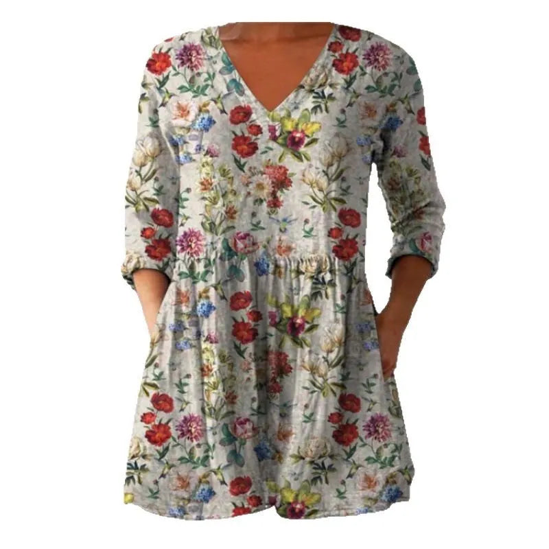 Women's printed loose dress with ruffled 3/4 wave sleeves and an elasticated waist on a hanger.
