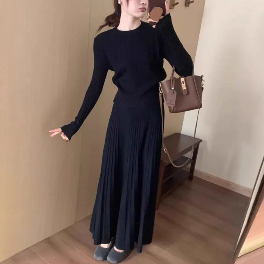 Dark grey knitted two-piece dress suit with 3D texture, featuring a sweater and skirt in artistic retro style.