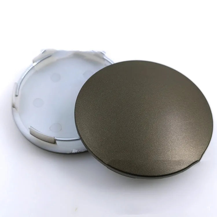 65mm diameter car wheel hub centre cap in antique copper finish with metal emblem.