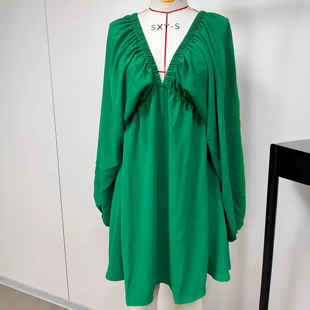 Women's apricot V-neck dress with long puff sleeves and a swing flounced skirt.