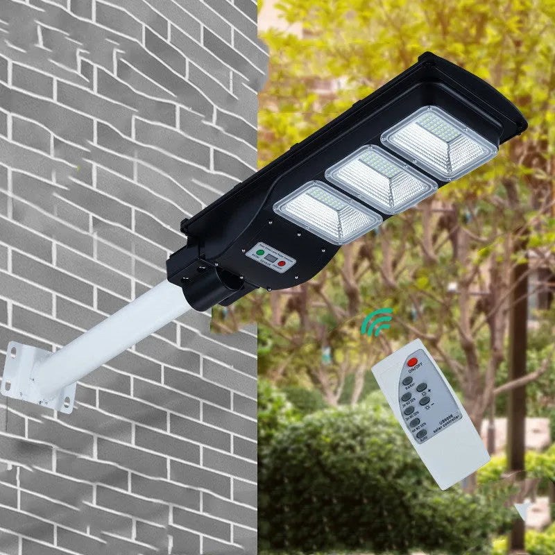 Integrated solar street light unit with solar panel and 60W LED lamp for outdoor use.