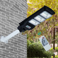Integrated solar street light unit with solar panel and 60W LED lamp for outdoor use.