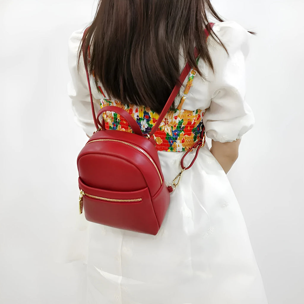 Soft PU mini backpack in street style, shown open to reveal internal phone pocket and zipper bag.
