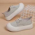 Women's camel suede platform loafers with a round toe, flat 4cm rubber sole, and front lace-up fastening.