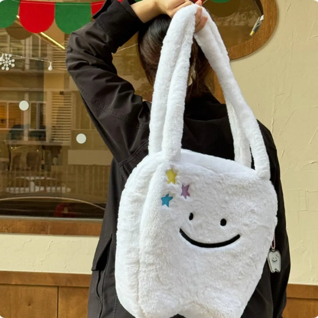 White plush shoulder tote bag with cute teeth design and zip opening