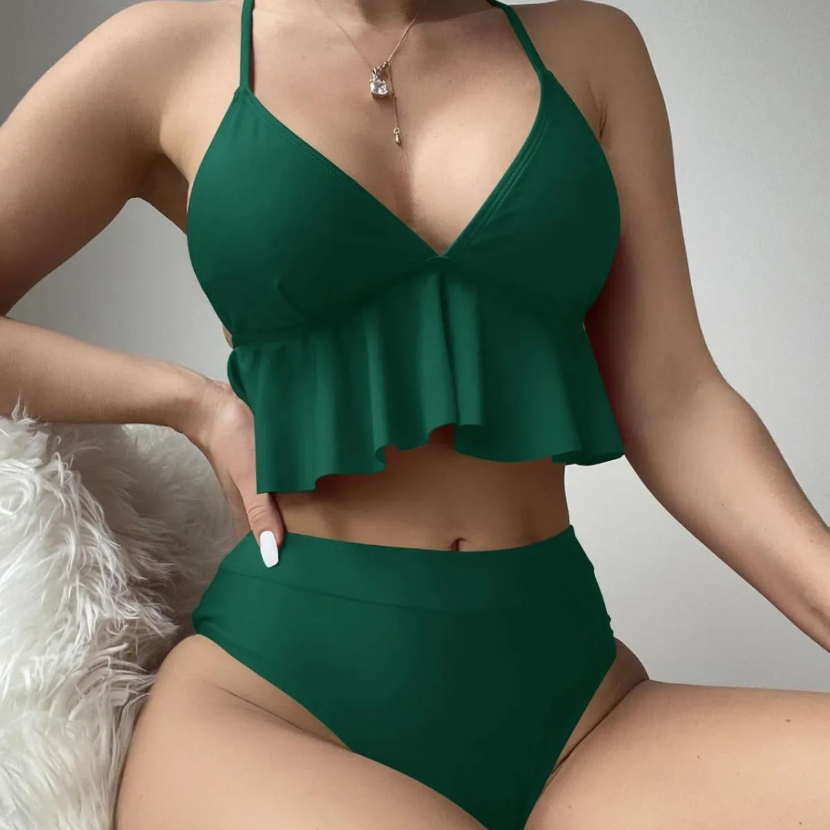 Women's solid colour split bikini swimsuit in polyester spandex fabric on mannequin