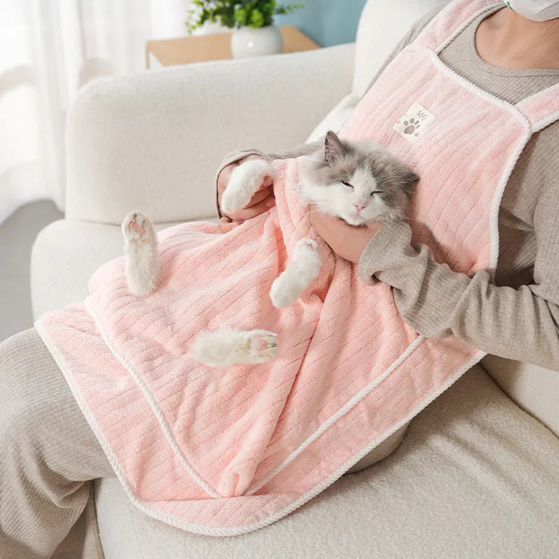 Cloth cat petting apron in a striped pattern, shown worn by a person holding a cat.