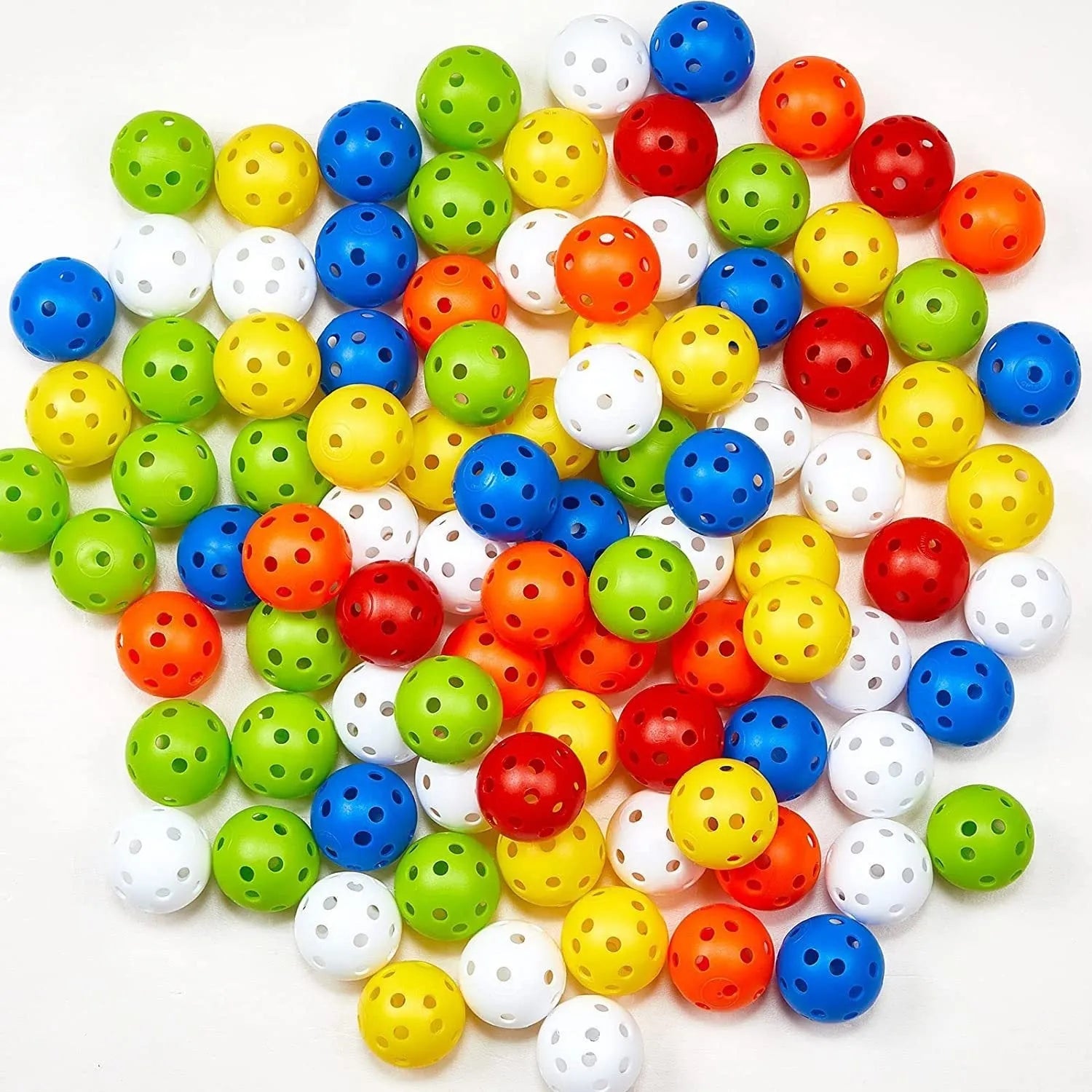 Assortment of red, orange, blue, green, white, and yellow 42mm golf practice balls in a net bag.