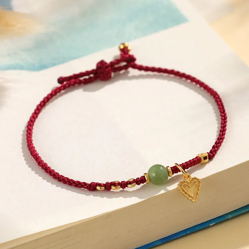 Handmade 925 silver and Hetian jade woven bracelet for women with red strap