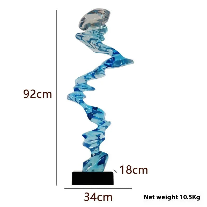 Ran Ran Rose abstract resin sculpture in bright gold, silver, or blue on a neutral background.