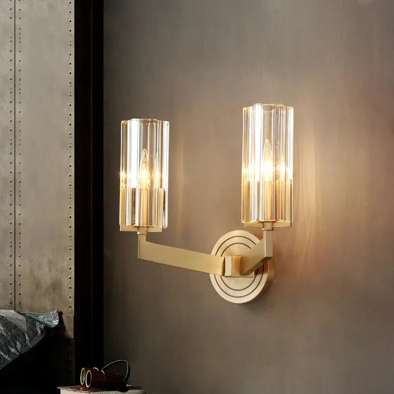 Modern minimalist copper wall lamp with single head on a white wall.