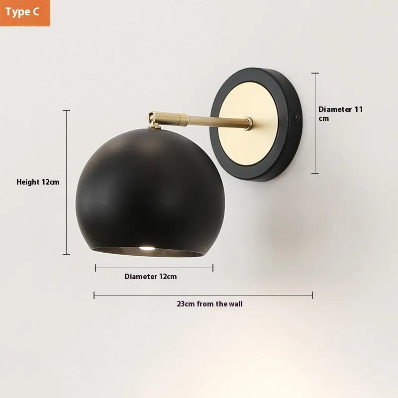 Nordic-style iron wall lamp mounted on a wall beside a bed.