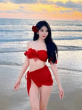 Women's red puff sleeve bikini set with skirt top and solid colour briefs on mannequin